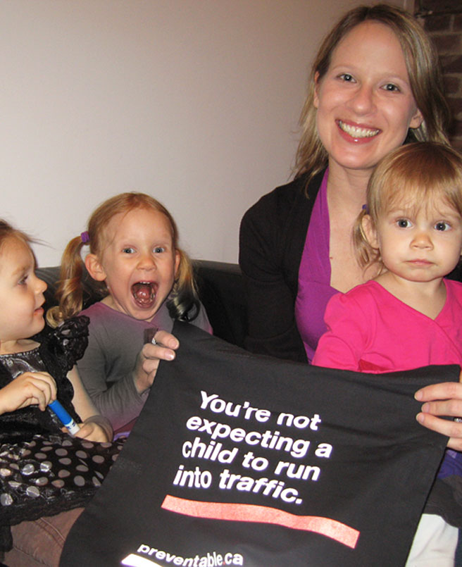 Picture of blogger, with future bloggers, and Preventable Halloween bags